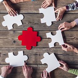 workers putting a puzzle together